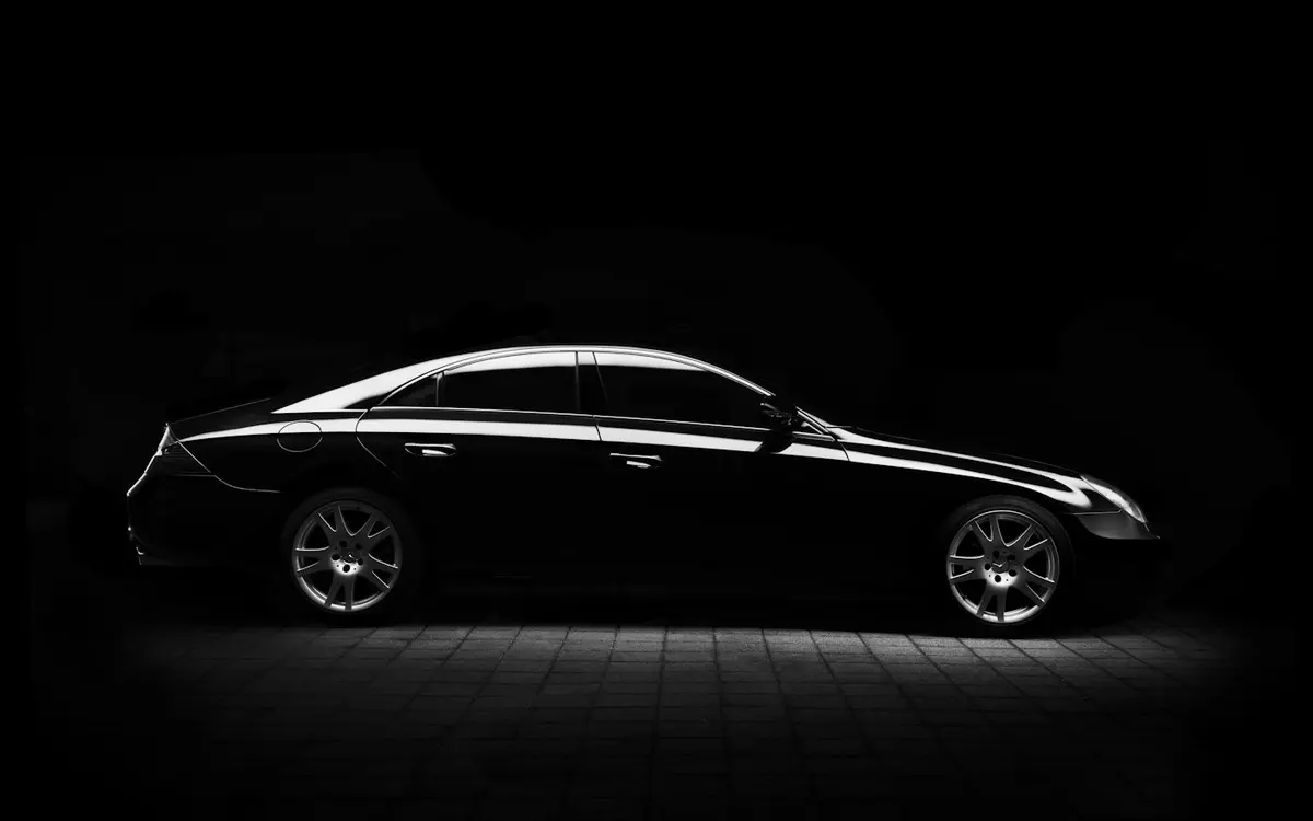 Sleek black car ready for a private transfer