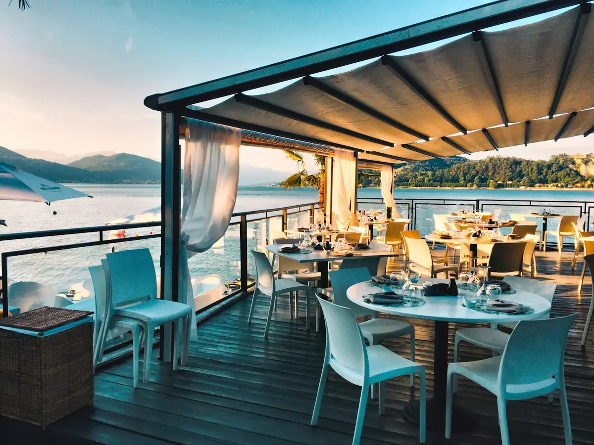 Table set by the sea at golden hour