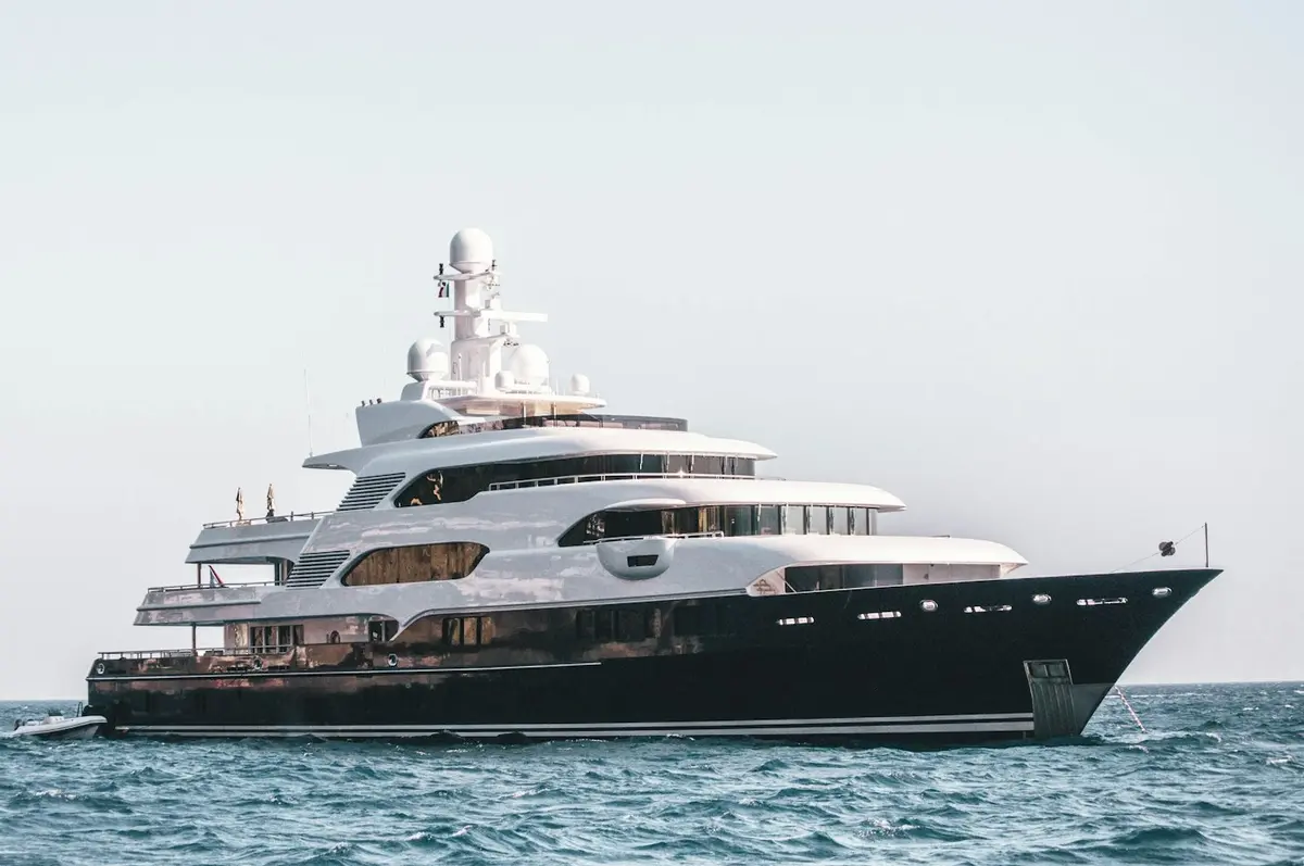 Large white yacht at anchor
