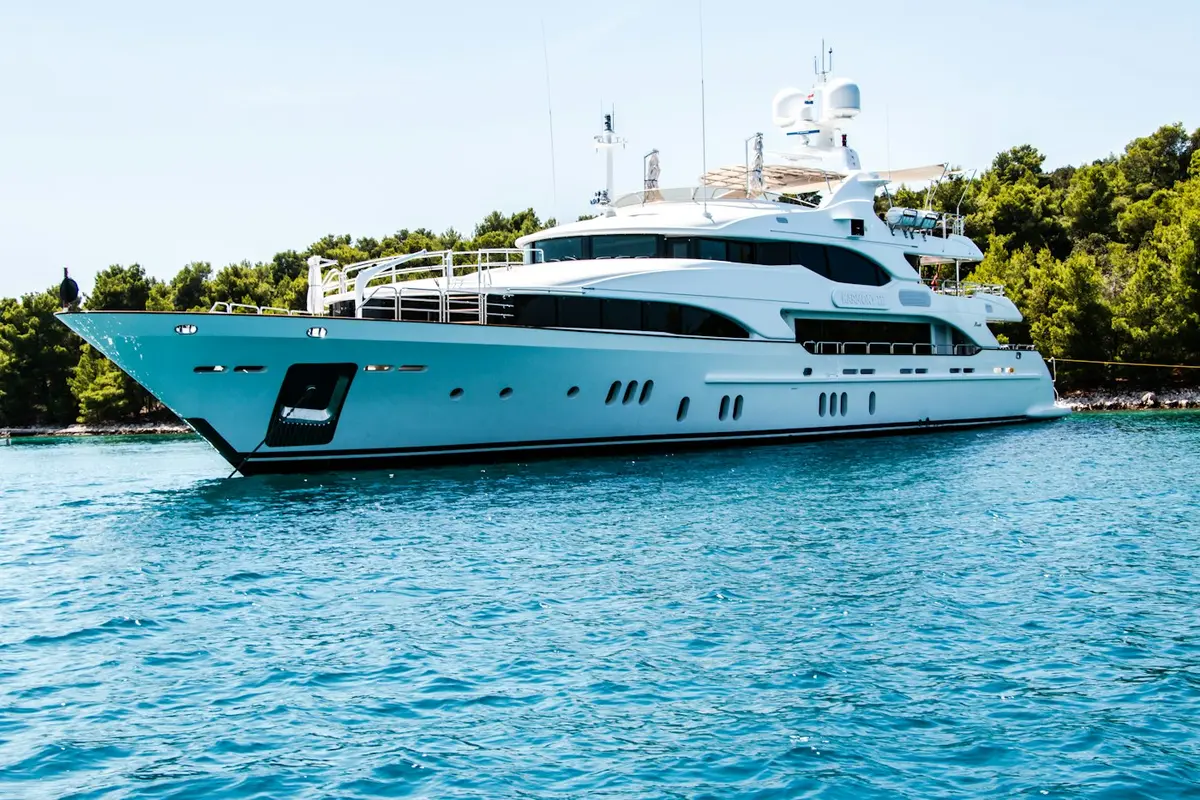 Yacht anchored in a sheltered green cove